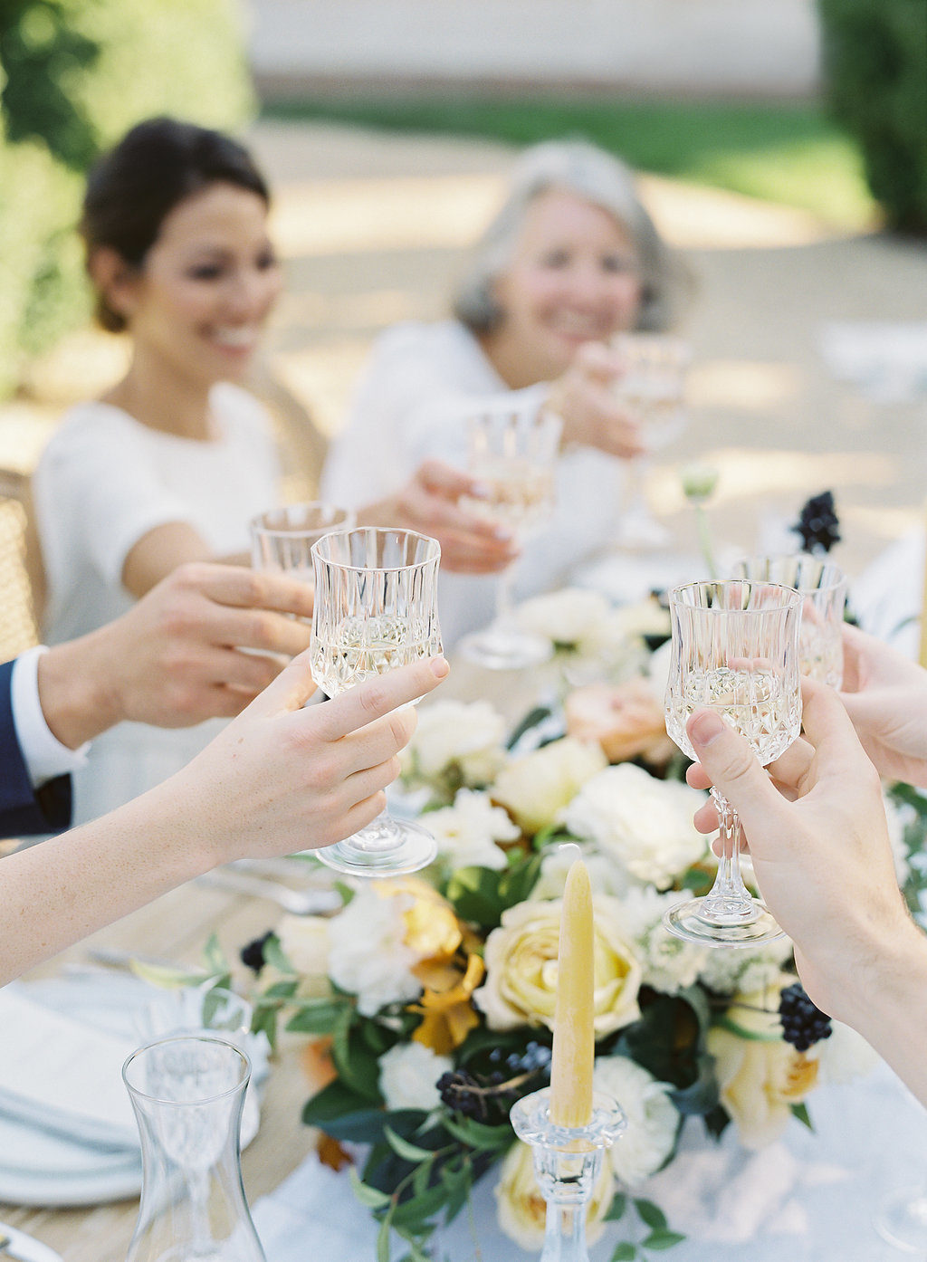 glasses toasting at wedding