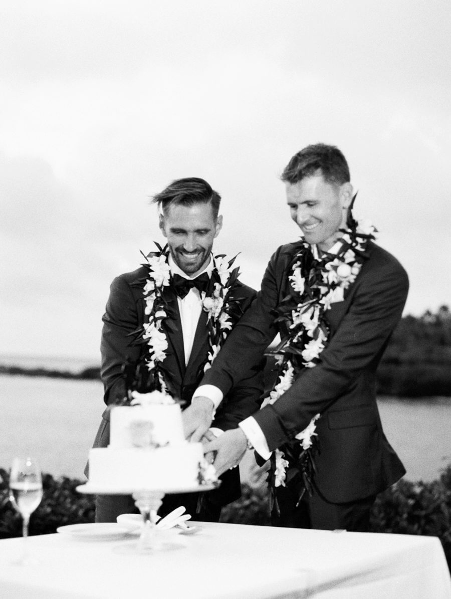 Grooms cutting cake