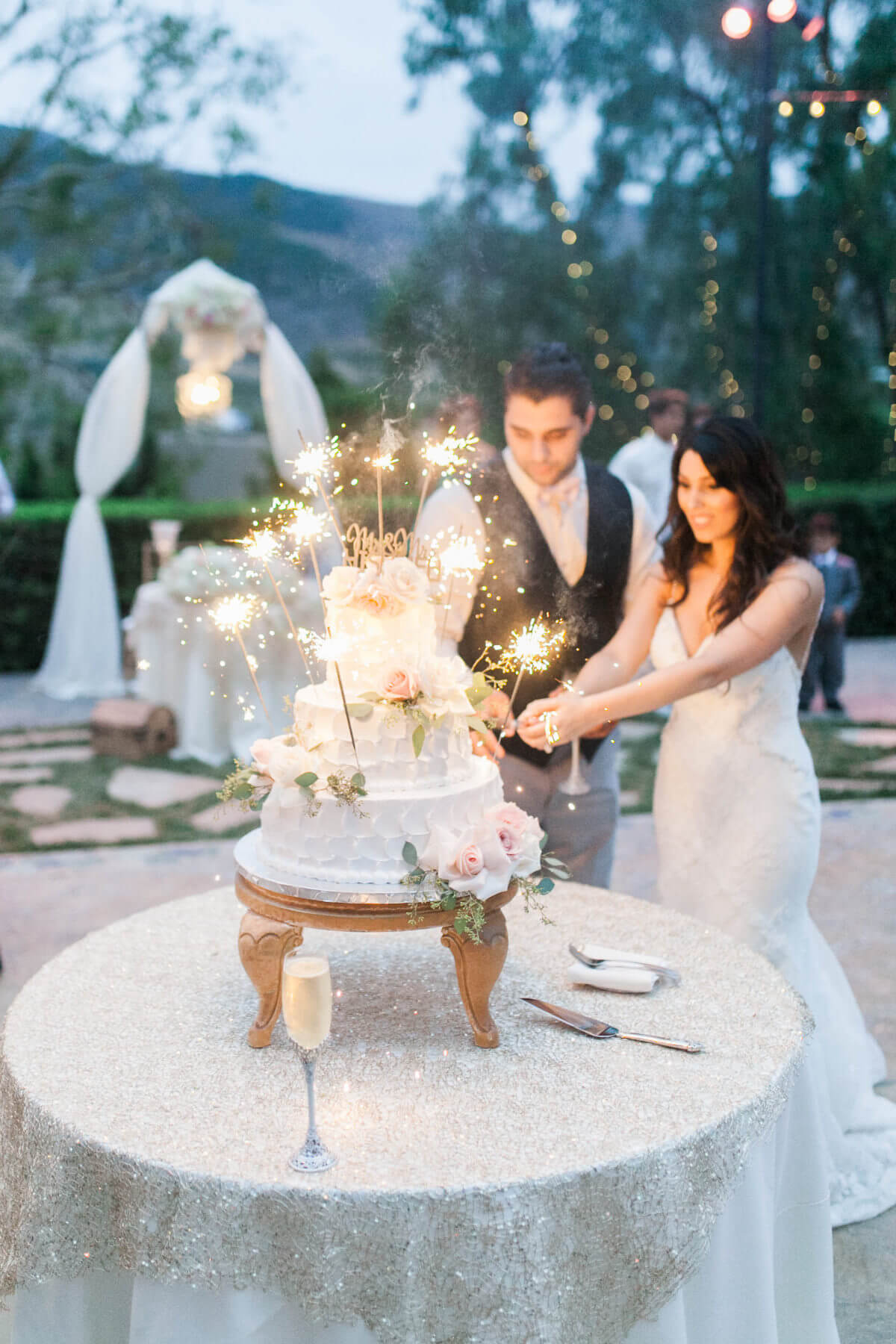 Brides and groom cutting cake