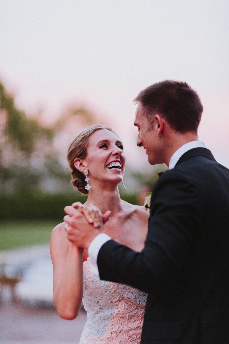 Bride and groom smiling and dancing