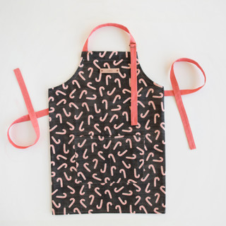 This is a black aprons by Hooray Creative called assorted candy canes in standard