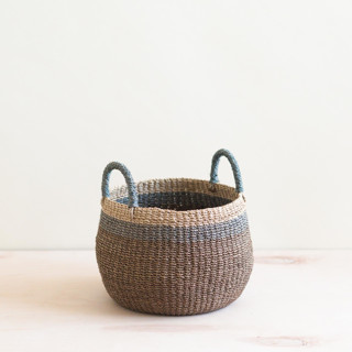 This is a brown accent pieces by LIKHA called brown bulge basket in standard