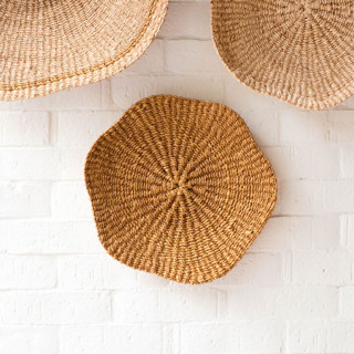 This is a brown accent pieces by LIKHA called small scallop wall basket 10" in standard