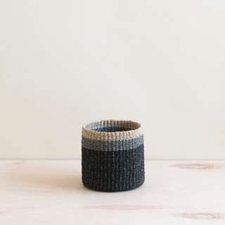 This is a black accent pieces by LIKHA called black cylinder tabletop basket in standard