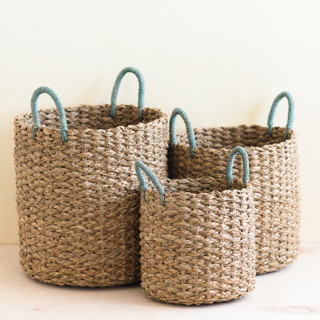 This is a natural accent pieces by LIKHA called sky blue seagrass cylinder basket with handles, nested set of 3 in standard