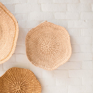 This is a natural accent pieces by LIKHA called medium scallop wall basket 12" in standard