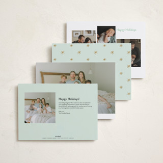 This is a golden babys first christmas with standard by Carolyn MacLaren called the more, the merrier printing on recycled smooth signature in standard