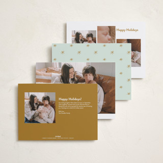 This is a golden babys first christmas with standard by Carolyn MacLaren called the more, the merrier printing on recycled smooth signature in standard
