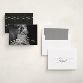 This is a newsprint foil stamped birth announcements with foil pressed by Heather Schertzer called intro printing on recycled smooth signature in standard
