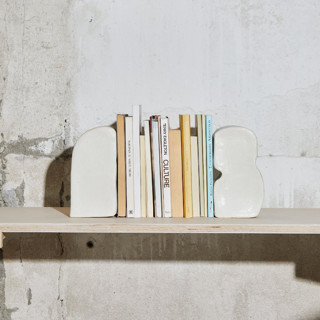 This is a gold accent pieces by Studiokuza called bookends design 2 in standard