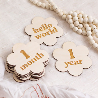 This is a beige nursery decor by The Print Pantry Team called flower baby milestone signs in standard