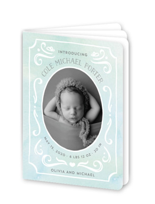 This is a blue birth announcement by JeAnna Casper called Ornate Frame with standard printing on signature80 in booklette.