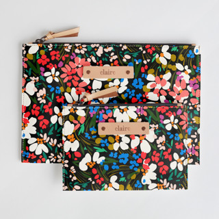 This is a roses zipper pouches by Angela Marzuki called garden club in standard