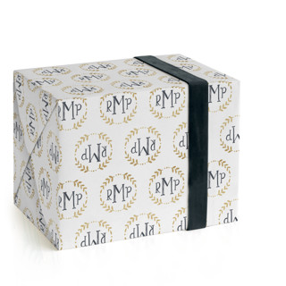 This is a champagne wrapping paper with standard by Erin Deegan called glittering monogram printing on wrapping paper in standard