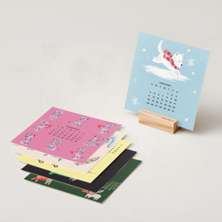 This is a bright photo calendars by Multiple Artists called year of dogs: 2026 minted desk calendar in standard