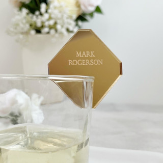This is a gold wedding drinkware by Self Stationery called personalised place name charms | luxury cocktail tags | set of 20 in standard