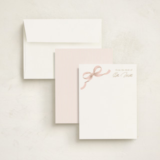 This is a blush foil stamped stationery with foil pressed by Paper Raven Co. called a little bow printing on signature in 4.25x5.5