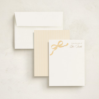 This is a buttercup foil stamped stationery with foil pressed by Paper Raven Co. called a little bow printing on signature in 4.25x5.5