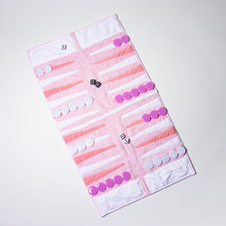 This is a pink home decor by 3rd Space by SBR called pink outdoor/travel backgammon set (plastic pieces) in standard
