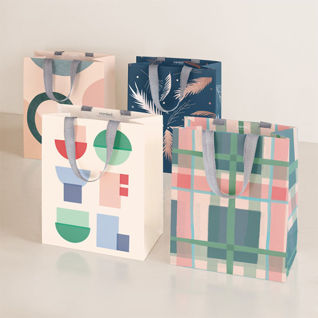 This is a peach wrapping paper by Multiple Artists called design lover's holiday in standard
