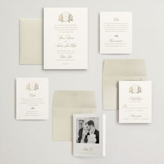 This is a ivory wedding invitations with foil pressed by Mansi Verma called gold crest printing on signature in grand