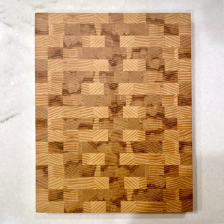 This is a black tableware by Sara Butorac called white ash end grain cutting board in standard