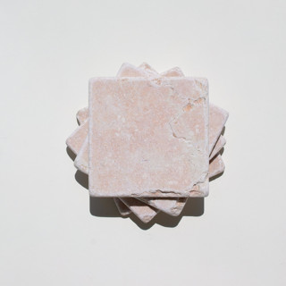 This is a pink tableware by the parmatile shop called marble coaster set (palm court) in standard