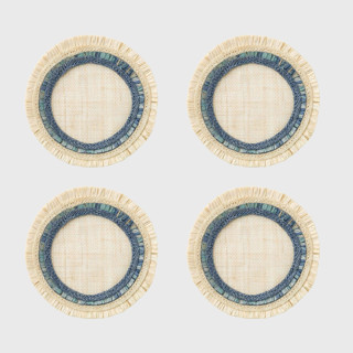 This is a blue tableware by Joanna Buchanan called ruffle edge straw coasters, indigo, set of four in standard