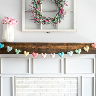 This is a multicolor holiday decorations by Nivas Collection called heart garland (soft rainbow, 6 feet) in standard