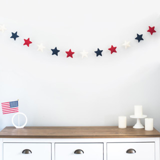 This is a multicolor holiday decorations by Nivas Collection called star garland (patriotic, 6 feet) in standard