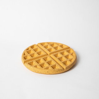 This is a yellow tableware by Pretti.Cool called marigold terrazzo waffle trivet in standard