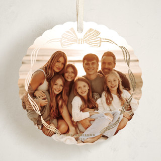 This is a sleigh bell holiday card ornaments with foil pressed by Pink House Press called bow frame printing on recycled smooth signature in ornament