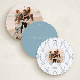 This is a frost holiday card ornaments with foil pressed by Pink House Press called bow frame printing on recycled smooth signature in ornament