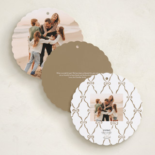 This is a sleigh bell holiday card ornaments with foil pressed by Pink House Press called bow frame printing on recycled smooth signature in ornament