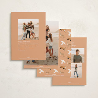 This is a peach foil pressed holiday cards with foil pressed by Elly called winter ribbon printing on recycled smooth signature in standard