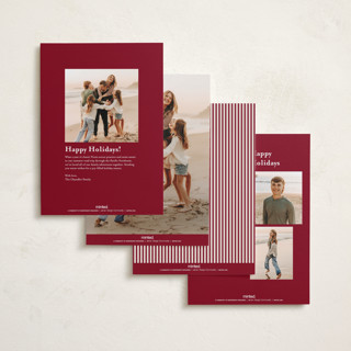 This is a cranberry foil pressed holiday cards with foil pressed by Kate Ahn called peppermint stripe printing on recycled smooth signature in standard