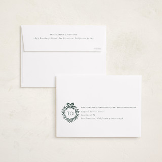 This is a evergreen foil pressed holiday cards with foil pressed by Melanie Kosuge called monogram trio printing on recycled smooth signature in standard