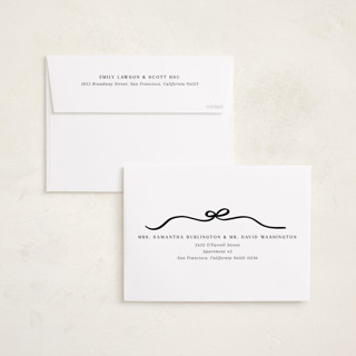 This is a coal foil pressed holiday cards with foil pressed by Kaydi Bishop called bow tied printing on recycled smooth signature in standard