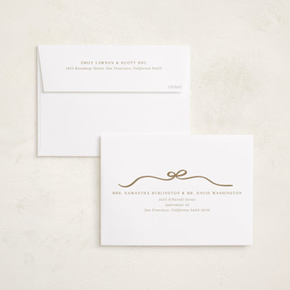 This is a eggnog foil pressed holiday cards with foil pressed by Kaydi Bishop called bow tied printing on recycled smooth signature in standard