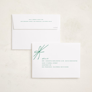 This is a juniper foil pressed holiday cards with foil pressed by Leia Matt called tied with joy printing on recycled smooth signature in standard
