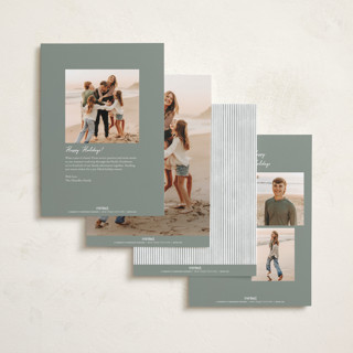 This is a sage foil pressed holiday cards with foil pressed by Jenna Holcomb called a cottage christmas printing on recycled smooth signature in standard