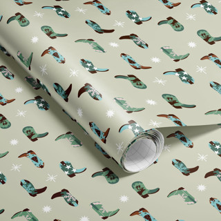 This is a green wrapping paper by tara berg called christmas cowboy boots wrapping paper in standard