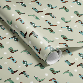 This is a green wrapping paper by tara berg called Christmas Cowboy Boots Wrapping Paper in standard.