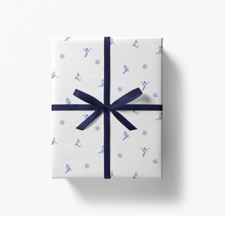 This is a white wrapping paper by Liesel Anne called après ski white and blue skier gift wrap [set of 3 sheets] in standard