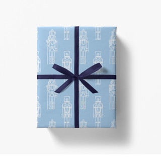 This is a blue wrapping paper by Liesel Anne called blue nutcracker christmas holiday gift wrap [set of 3 sheets] in standard