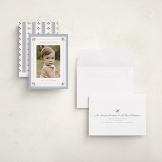 This is a powder blue petite holiday cards with standard by Wildfield Paper Co called holly berry border printing on recycled smooth signature in petite