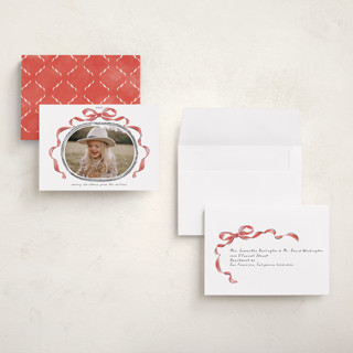 This is a pomegranate petite holiday cards with standard by Susan Zinader called whimsical bow printing on recycled smooth signature in petite