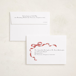 This is a pomegranate petite holiday cards with standard by Susan Zinader called whimsical bow printing on recycled smooth signature in petite