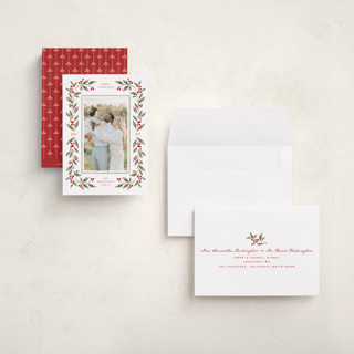 This is a mistletoe petite holiday cards with standard by Wildfield Paper Co called poinsettia + pine printing on recycled smooth signature in petite