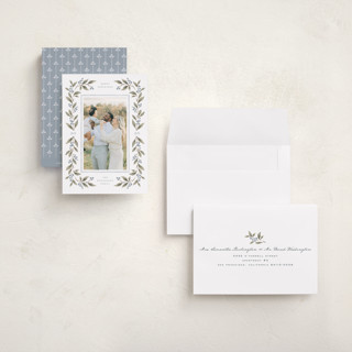 This is a juniper berry petite holiday cards with standard by Wildfield Paper Co called poinsettia + pine printing on recycled smooth signature in petite